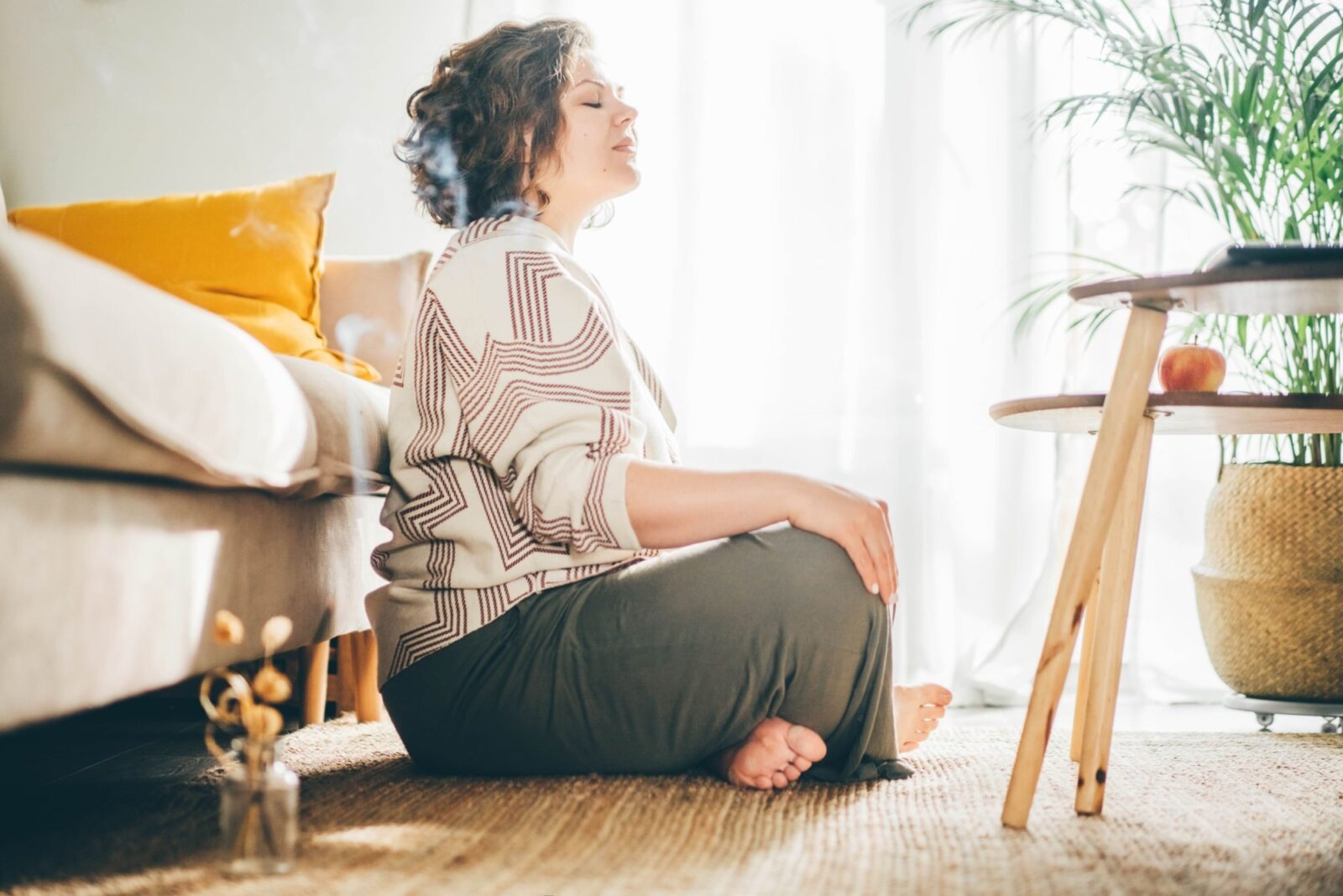 woman doing yoga and meditation at home