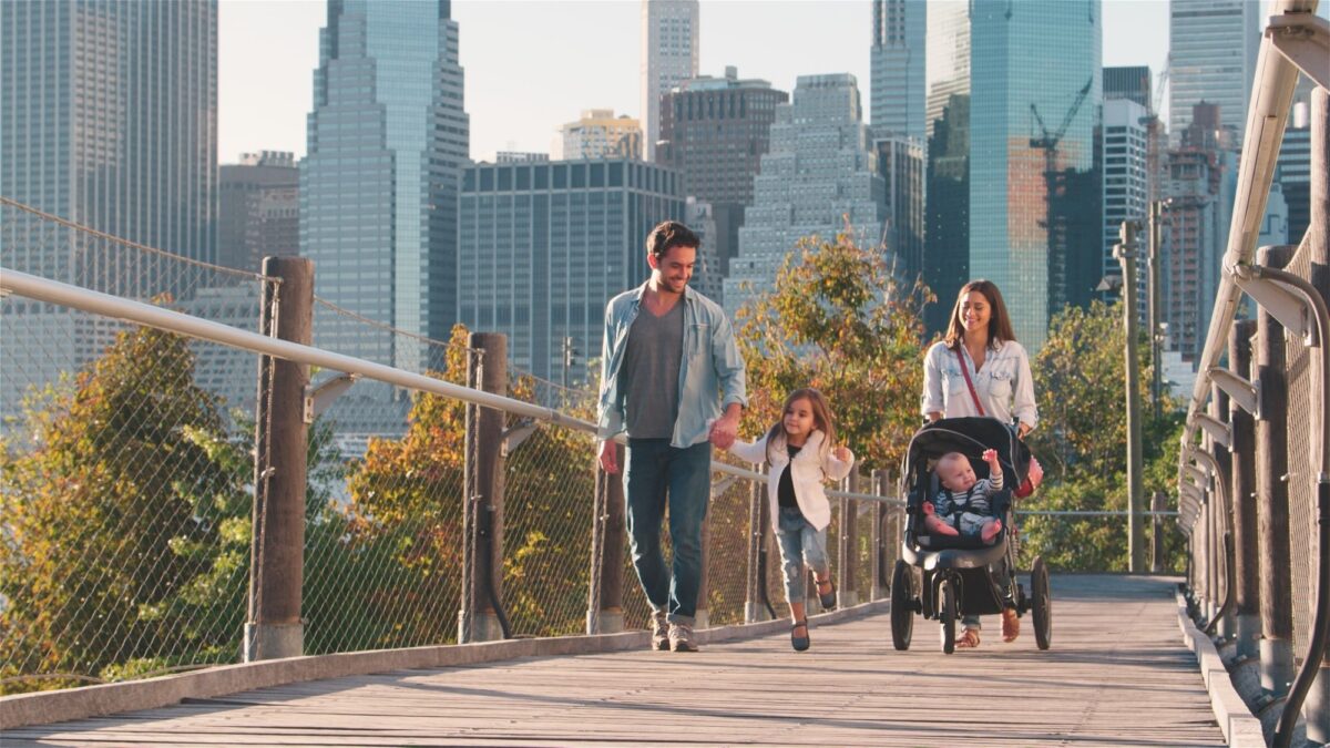 Family Day Out In New York City With Mum Pushing Baby In Buggy